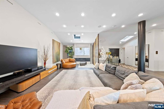 living room featuring lofted ceiling with skylight