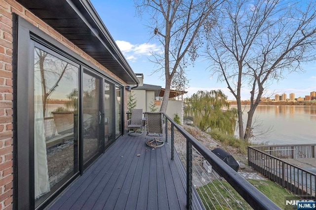 wooden deck with a water view