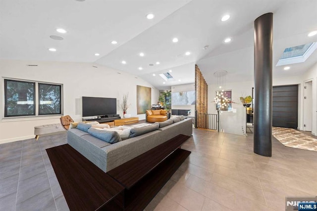 tiled living room with lofted ceiling with skylight