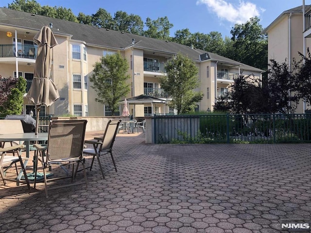 view of patio featuring fence