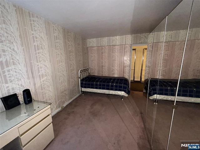 unfurnished bedroom featuring dark colored carpet