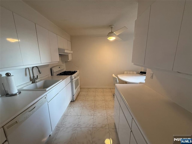 kitchen with ceiling fan, white appliances, sink, and white cabinets