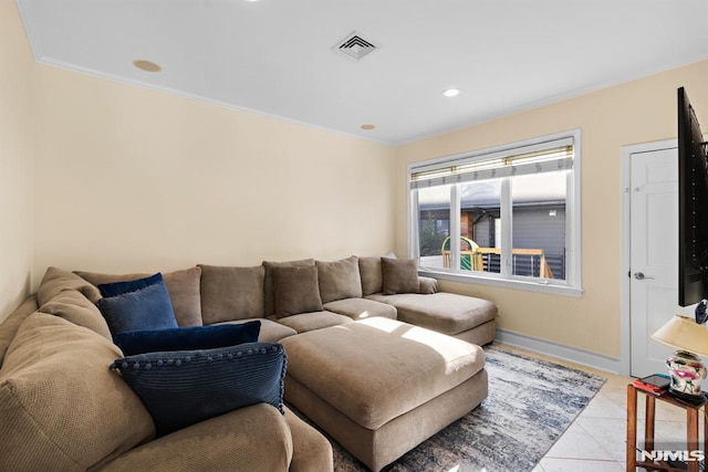 living room with baseboards, light tile patterned flooring, visible vents, and recessed lighting