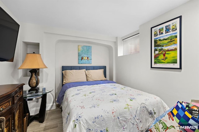 bedroom featuring wood finished floors