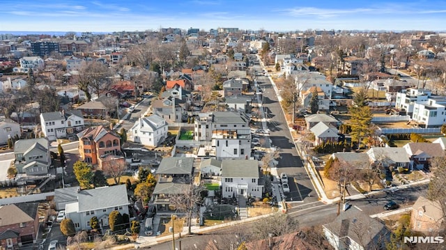 birds eye view of property with a residential view