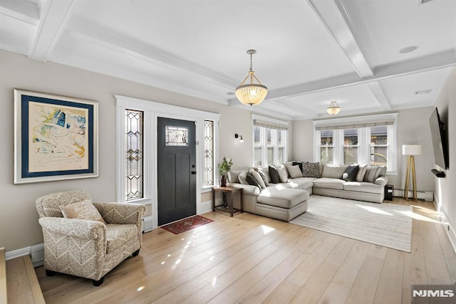 entryway with light wood-style flooring, baseboards, baseboard heating, and beam ceiling