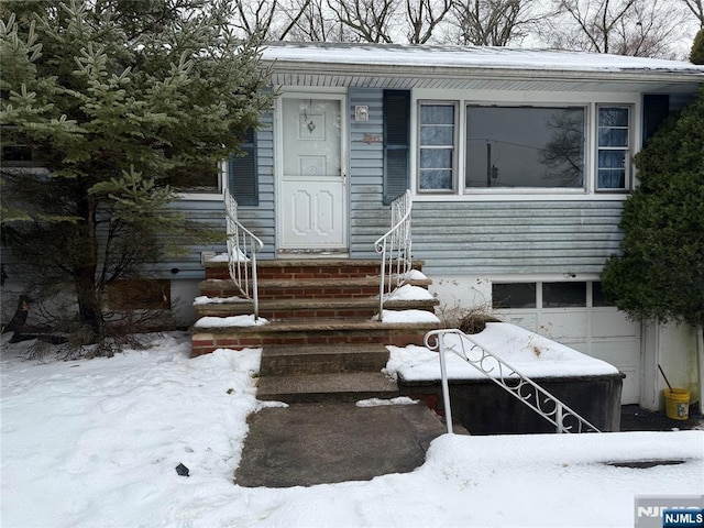 view of front of home with a garage