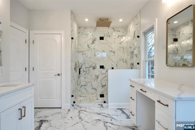 bathroom featuring vanity and a shower with shower door