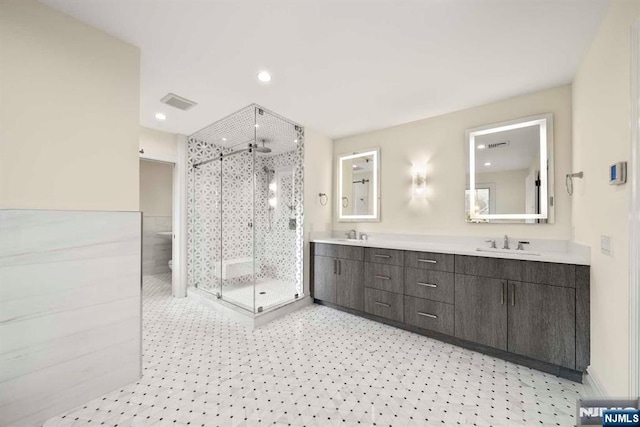 bathroom featuring vanity and walk in shower