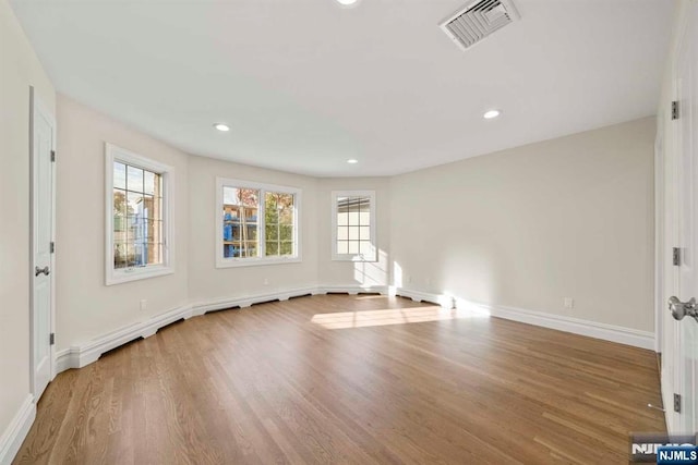 spare room featuring hardwood / wood-style flooring