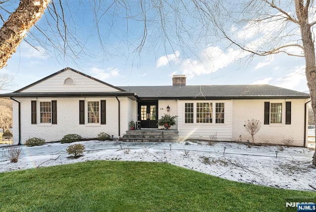 view of front of home with a lawn