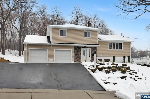 view of front of property with a garage