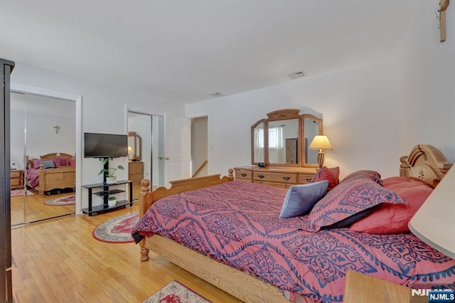 bedroom with hardwood / wood-style floors