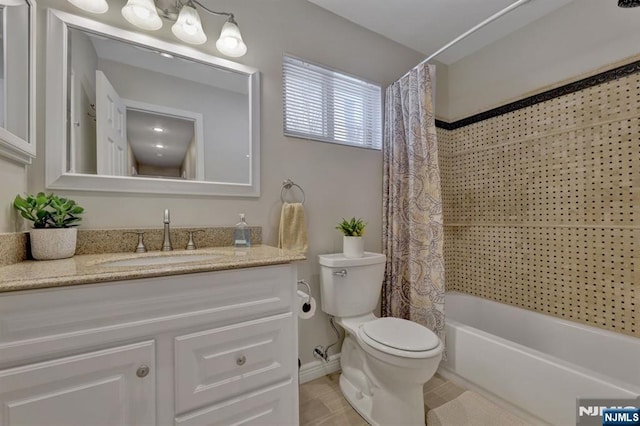 full bathroom with vanity, tile patterned floors, toilet, and shower / bath combo with shower curtain