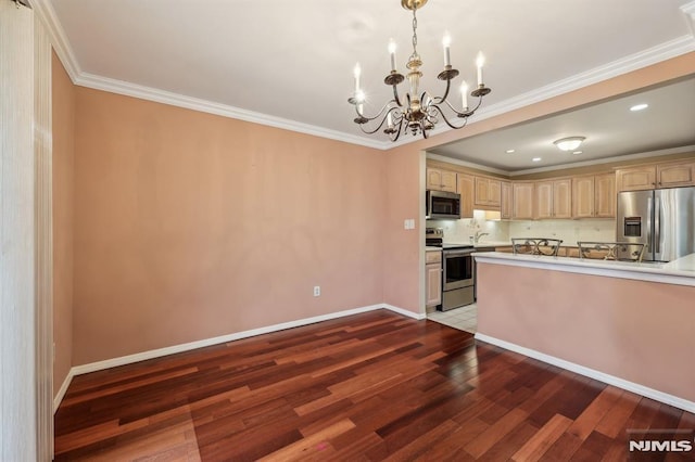 kitchen featuring a chandelier, light brown cabinets, stainless steel appliances, ornamental molding, and dark wood finished floors