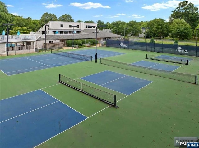 view of sport court with fence