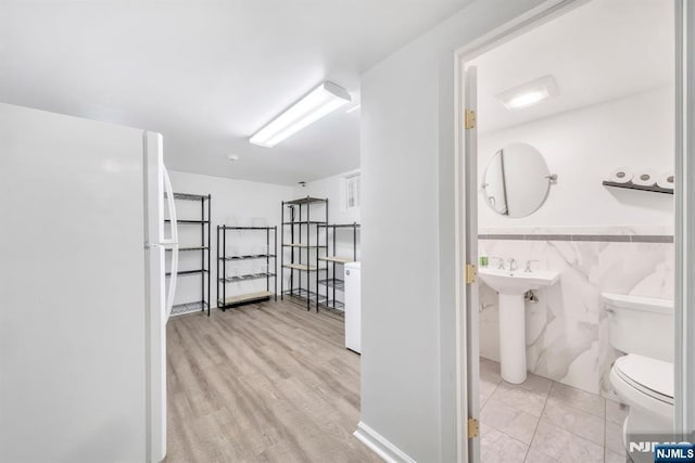 interior space with sink and light hardwood / wood-style flooring