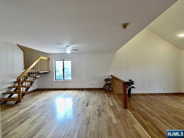 additional living space featuring hardwood / wood-style floors and ceiling fan