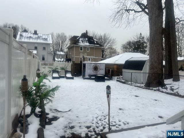 view of yard covered in snow