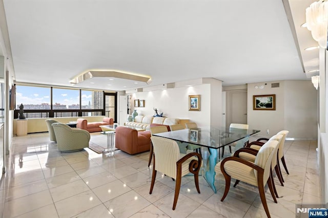 dining room featuring a wall of windows