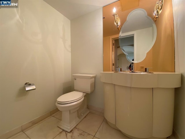 bathroom with vanity, tile patterned floors, and toilet