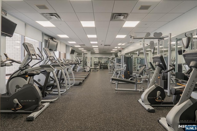 exercise room featuring a drop ceiling