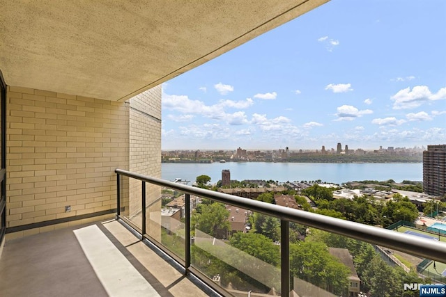 balcony featuring a water view