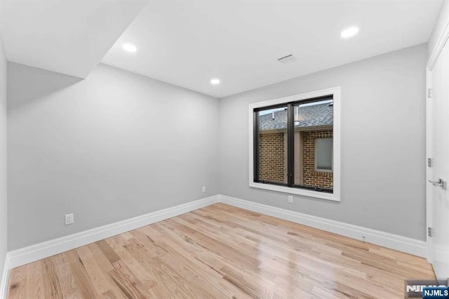 unfurnished room featuring light hardwood / wood-style flooring