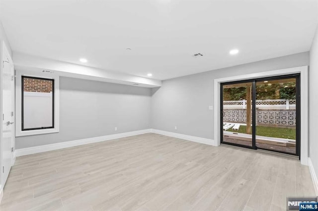 unfurnished room featuring light wood-type flooring