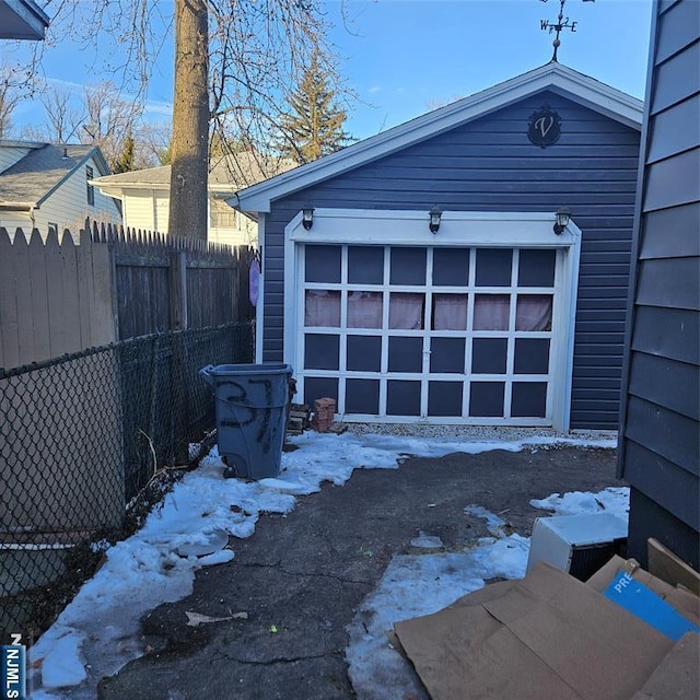 view of snow covered garage