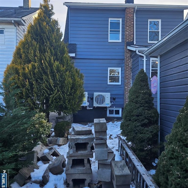 rear view of property featuring ac unit