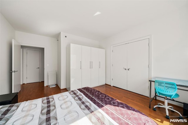 bedroom featuring wood finished floors