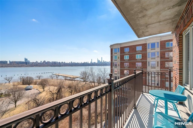 balcony featuring a water view