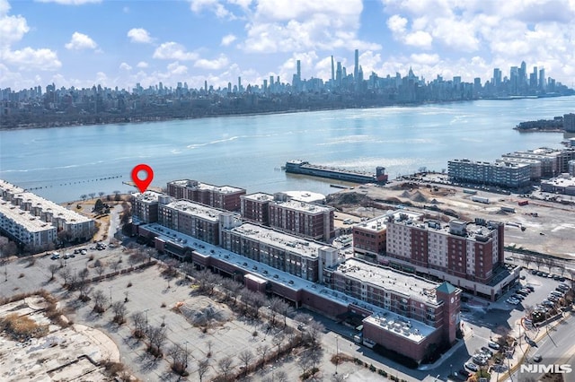 aerial view with a city view and a water view