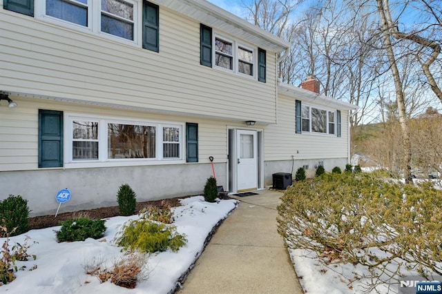 tri-level home with a chimney