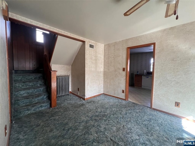 interior space featuring radiator and ceiling fan