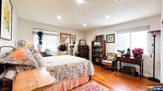 bedroom with hardwood / wood-style flooring