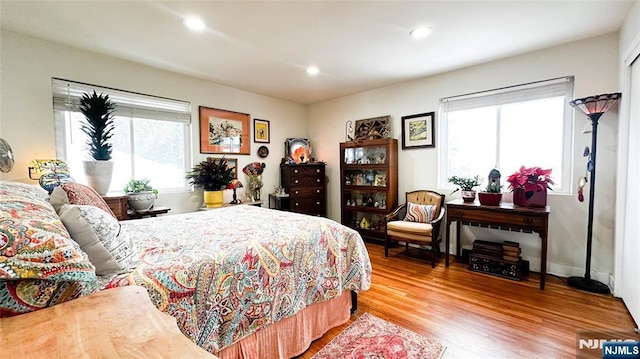 bedroom with hardwood / wood-style floors