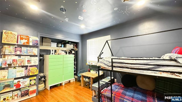 bedroom with hardwood / wood-style flooring