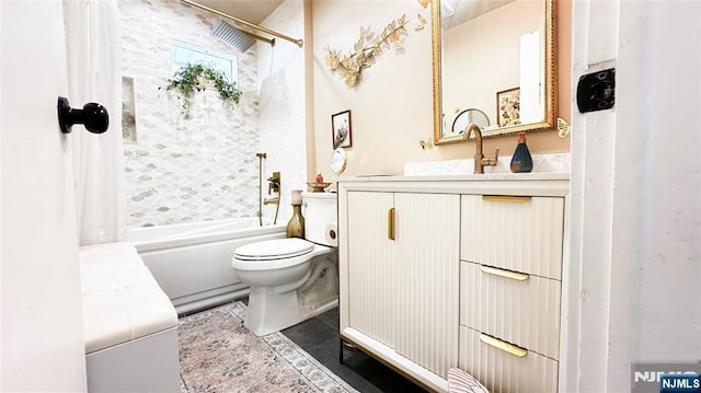 full bathroom with tile patterned floors, vanity, toilet, and tiled shower / bath combo