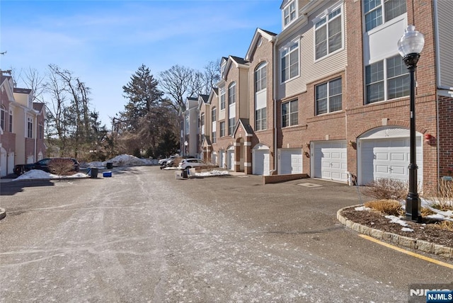 view of street with a residential view and curbs