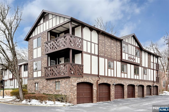 snow covered building featuring a garage