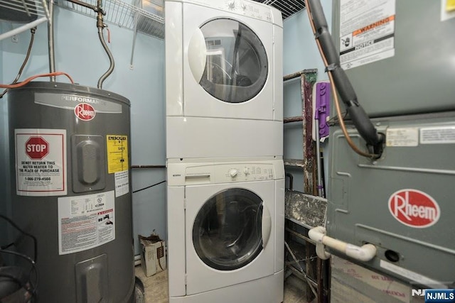 laundry room with water heater and stacked washer and dryer