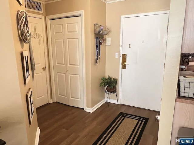 entrance foyer with dark hardwood / wood-style floors