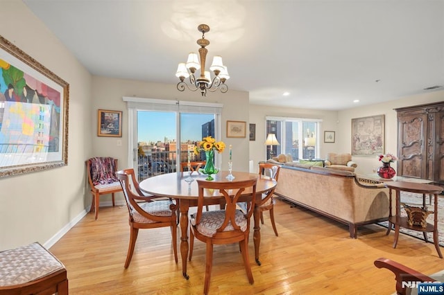 dining space featuring a chandelier, recessed lighting, visible vents, baseboards, and light wood-type flooring