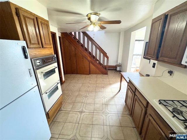 kitchen with ceiling fan and white appliances