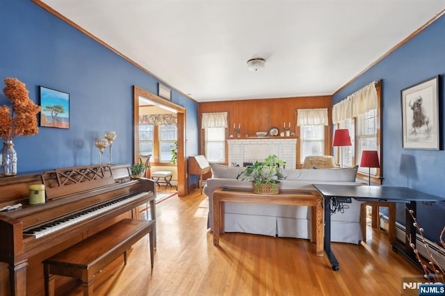 living room with light wood finished floors and a brick fireplace