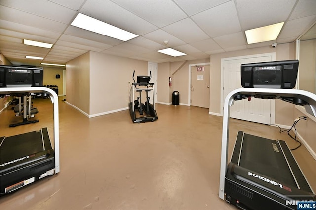 exercise area with a paneled ceiling