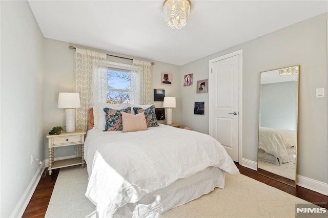 bedroom featuring dark hardwood / wood-style floors