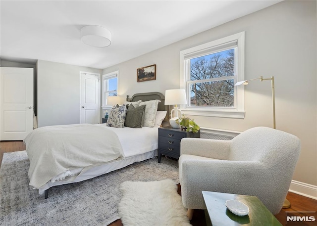 bedroom with wood-type flooring